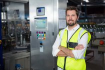Portrait of confident male worker standing in factory — Stock Photo