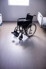 Empty wheelchair in ward at hospital — Stock Photo