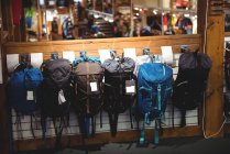 Variety of sports bags on rack in store — Stock Photo
