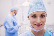 Portrait of female dentist smiling in clinic — Stock Photo