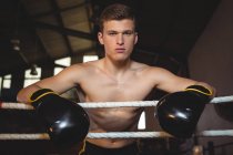 Portrait of boxer standing in boxing ring — Stock Photo