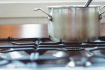 Close-up cooking pot kept on a stove while cooking — Stock Photo