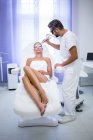 Female patient getting lifting procedure in beauty salon — Stock Photo