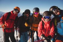 Group of skiers having fun in ski resort during winter — Stock Photo