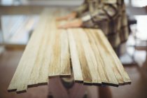 Wooden planks in surfboard workshop — Stock Photo