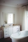 Empty bathroom with bathtub and bathroom chest at home — Stock Photo