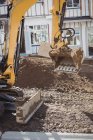 Bulldozer levelling soil at construction site — Stock Photo
