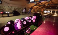 Close up of bowling balls in bowling alley — Stock Photo