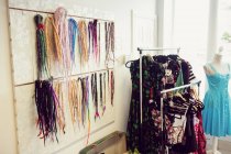 Assorted colorful artificial dreadlocks in shop — Stock Photo