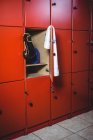 Boxing gloves and towel in locker room at fitness studio — Stock Photo