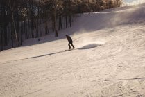 Skier skiing on the snowy mountain slope — Stock Photo