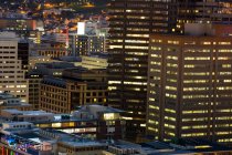 Aerial view of business towers in city at night — Stock Photo