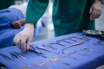 Hand of surgeon performing operation in operation theater of hospital — Stock Photo