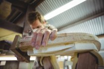 Close-up of man making surfboard in workshop — Stock Photo