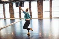Woman practicing a dance in dance studio — Stock Photo