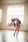 Pretty woman practicing hip hop dance in studio — Stock Photo