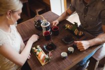 High angle view of couple having sushi in restaurant — Stock Photo