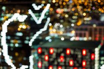 Abstract bokeh of busy city street at night — Stock Photo