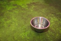 Empty dog bowl on floor at dog care centre — Stock Photo