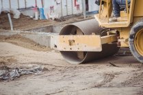 Low section of man operating bulldozer at construction site — Stock Photo