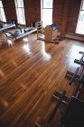 Sport equipment in empty fitness studio interior — Stock Photo