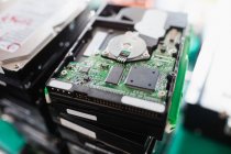 Close-up of an opened hard drive in repair shop — Stock Photo