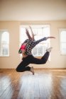 Young woman practicing hip hop dance in studio — Stock Photo