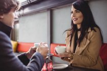 Couple having coffee together in restaurant — Stock Photo