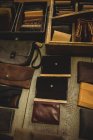 Various leather accessories on table in workshop — Stock Photo