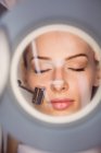 Close-up of dermatologist performing laser hair removal on patient face in clinic — Stock Photo