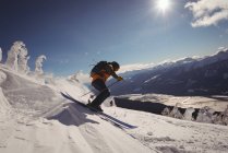 Skier skiing in snowy alps during winter — Stock Photo
