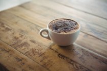 Coffee cup on a table in cafe — Stock Photo
