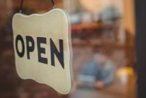 Close-up of open sign outside a cafe — Stock Photo