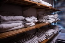 Folded blankets arranged in shelf at hospital — Stock Photo