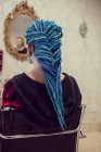 Rear view of woman with dreadlocks in salon — Stock Photo