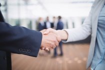 Close-up of business people shaking hands — Stock Photo