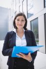 Portrait of a Confident businesswoman standing outside office building — Stock Photo