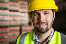Close up portrait of worker in warehouse — Stock Photo