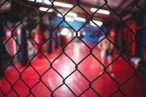 Close-up of wire mesh fence in fitness studio — Stock Photo