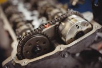Close-up of car engine chain and gears in repair garage — Stock Photo