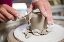 Close-up of potter making pot in workshop — Stock Photo