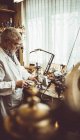 Horologist using a horological milling machine in the workshop — Stock Photo