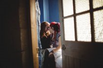 Young hipster couple romancing in bedroom at home — Stock Photo