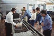 Passengers in airport security check at airport — Stock Photo