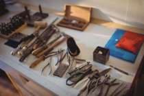Goldsmith work tools on workbench in workshop — Stock Photo