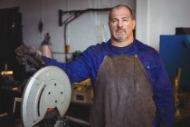 Portrait of welder standing in workshop — Stock Photo