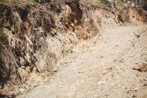 Empty dirt road on hill — Stock Photo
