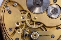 Close-up of old pocket watch machine with gears — Stock Photo