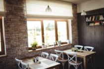 Empty chairs and tables in bakery shop, blurred — Stock Photo