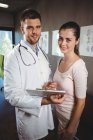 Portrait of physiotherapist and female patient in clinic — Stock Photo